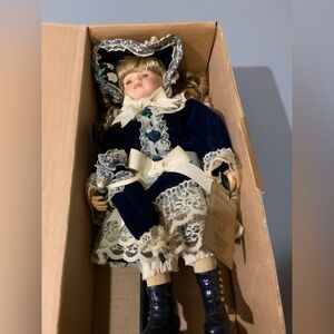 Elegant Porcelain Doll in Blue and White Dress